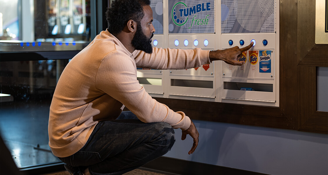 a man buying Tide from the vending machine