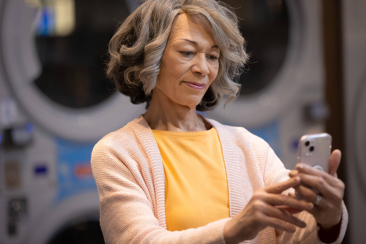 an older woman using her smartphone