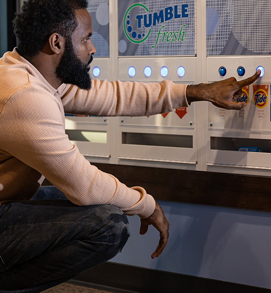 a man buying Tide from the vending machine